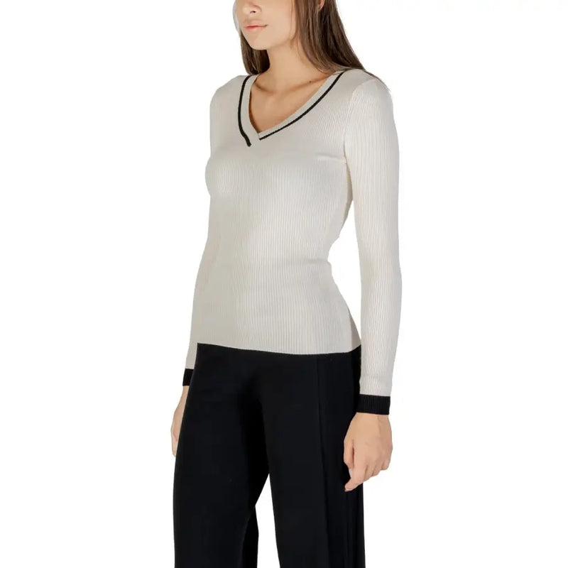Cream ribbed knit long-sleeve sweater with black-trimmed V-neck and cuffs for women