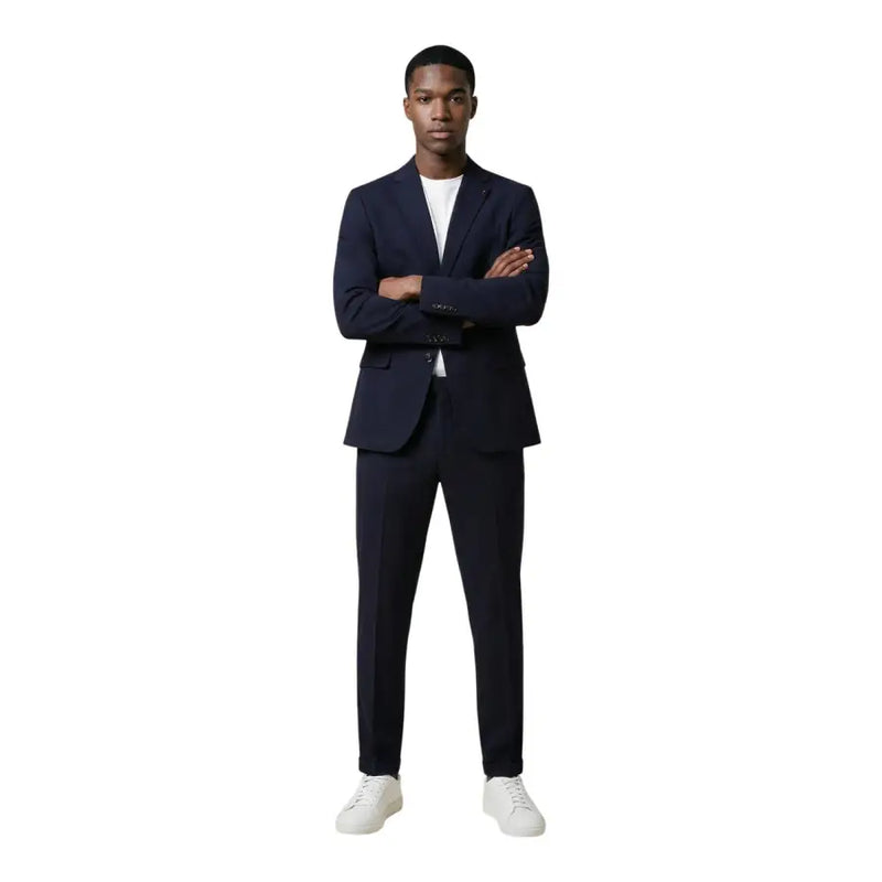 Mulish Costume homme bleu marine en mélange de coton imprimé léopard, col à revers en V, coupe impeccable et texture subtile.