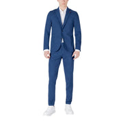 Men’s blue pinstripe summer suit with white shirt and white sneakers displayed in Mulish Men product