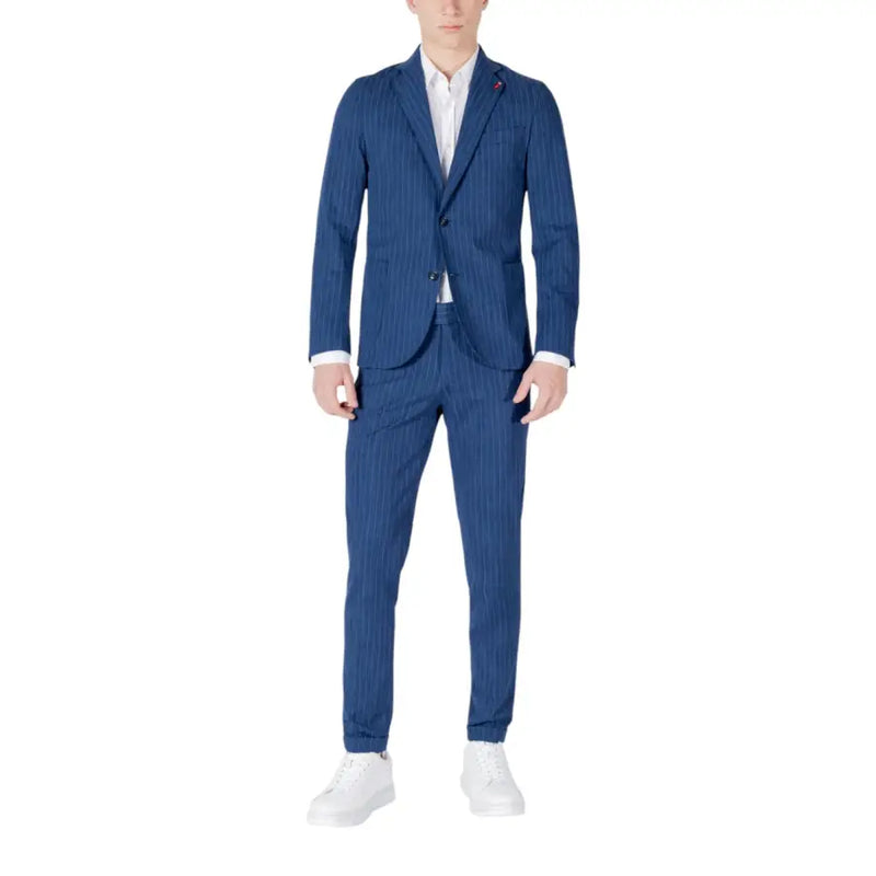 Men’s blue pinstripe summer suit with white shirt and white sneakers displayed in Mulish Men product