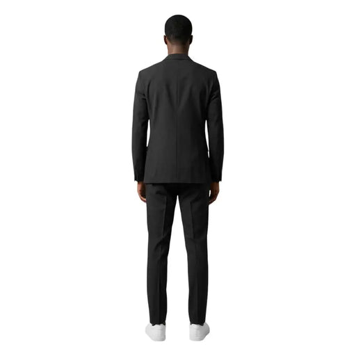 Mulish Costume homme noir, veste cintrée, coupe moderne et élégante, en polyester viscose à la texture subtile.