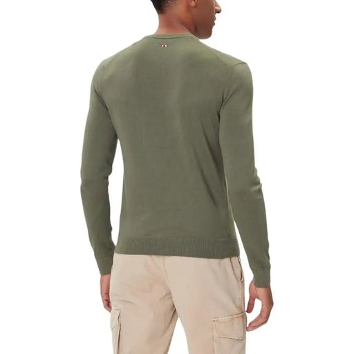Olive green crew neck sweater with ribbed cuffs and hem, likely made of cotton or polyester blend.