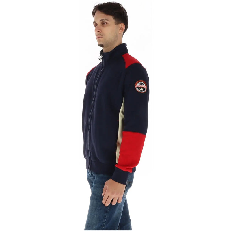 Napapijri Sweat-shirt à col roulé bleu en coton pour homme, avec empiècements en polaire bicolores bleu marine et rouge et écusson logo sur la manche gauche.