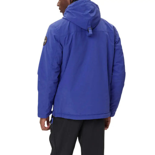 Royal blue waterproof jacket with hood and patch on sleeve, possibly north face model.