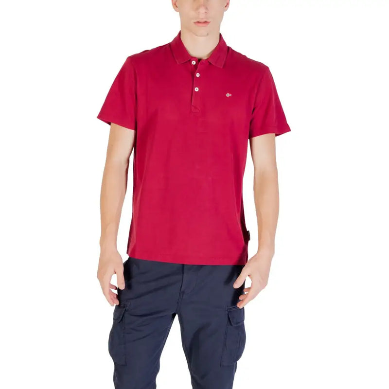 Red lacoste polo shirt with navy cargo pants and a small crocodile logo on the chest.