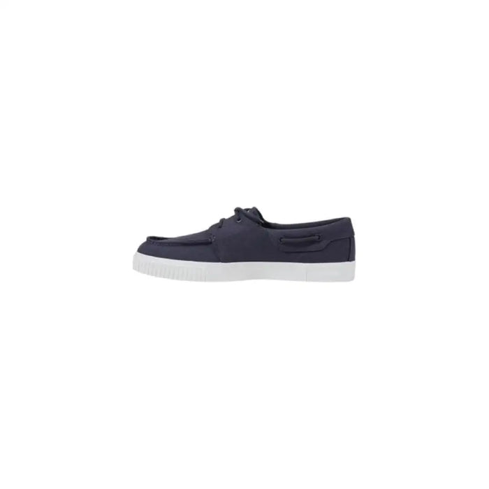 Navy blue boat shoe with white sole, stylish and comfortable for casual wear