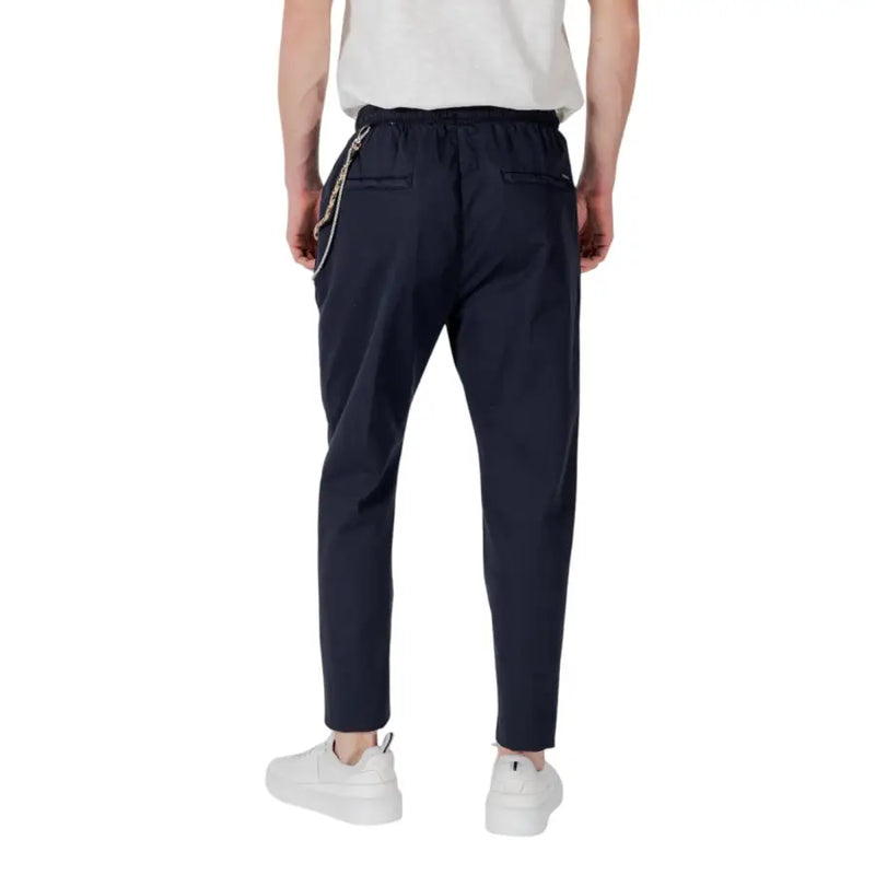 Navy blue drawstring tapered trousers with a decorative chain detail on the side seam for stylish comfort