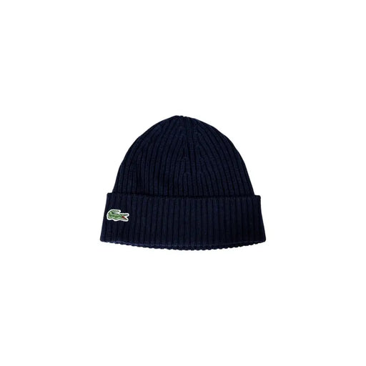 Navy blue Lacoste beanie with logo displayed on black knit beanie product image