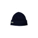 Navy blue Lacoste beanie with logo displayed on black knit beanie product image