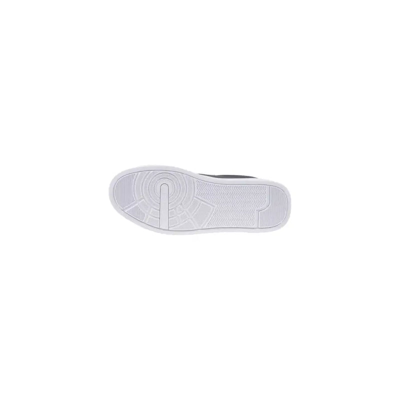 Navy blue leather sneaker with white rubber sole featuring a textured circular tread and subtle geometric design