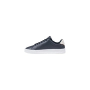 Dark navy leather low-top sneaker with white rubber sole and cream-colored heel tab by Tommy Hilfiger