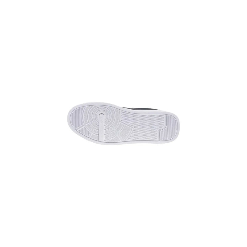Navy blue leather sneaker with white rubber sole featuring a textured circular tread and subtle geometric design