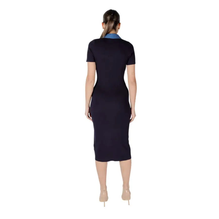 Navy blue midi dress with denim accents displayed in a product listing