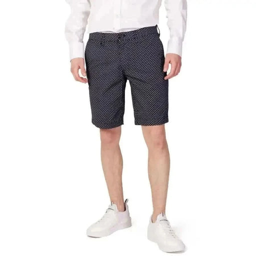 Armani Exchange Men Shorts Navy Blue Patterned with Small White Dots Worn by Person in White Shirt