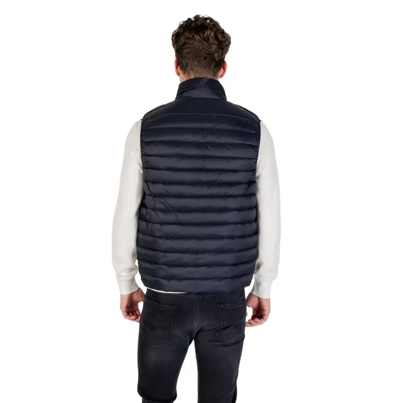 Navy blue quilted puffer vest made of insulated material for warmth and outdoor use