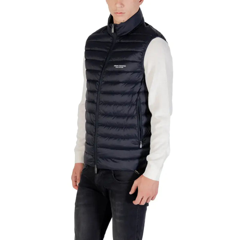 Navy blue puffer vest with black quilted high collar front zipper and subtle chest branding in durable material