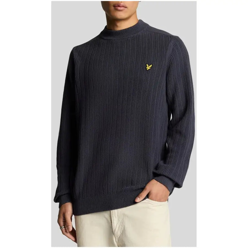 Navy blue ribbed knit sweater featuring a yellow bird logo on the chest made from soft material
