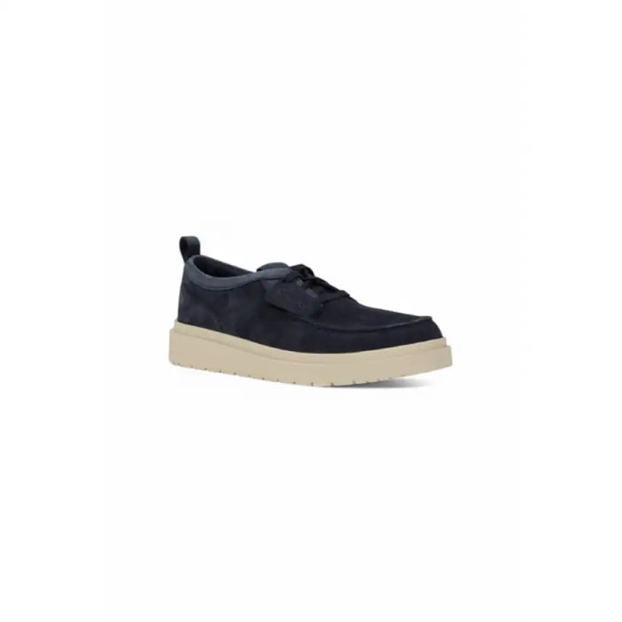 Navy blue suede moccasin shoe displayed in a product listing image