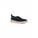 Navy blue suede moccasin shoe displayed in a product listing image