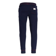 Navy blue sweatpants with maroon trim and a red drawstring shown from the back highlighting a white label on the pocket