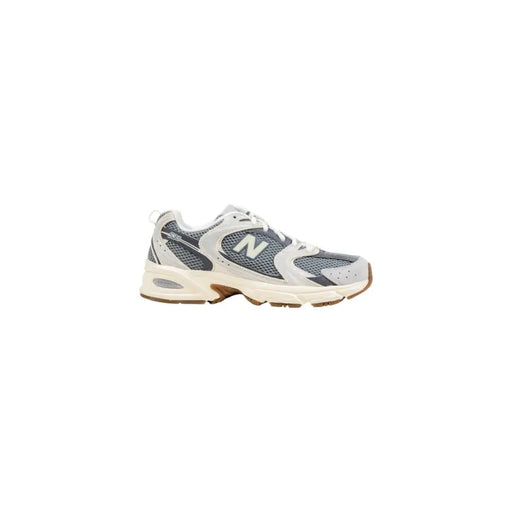 Gray and white New Balance 320 women’s suede slip-on sneakers with mesh upper and rubber sole