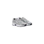 New Balance Baskets grises en textile pour homme avec maille argentée et détails blancs et noirs, conçues pour la course à pied