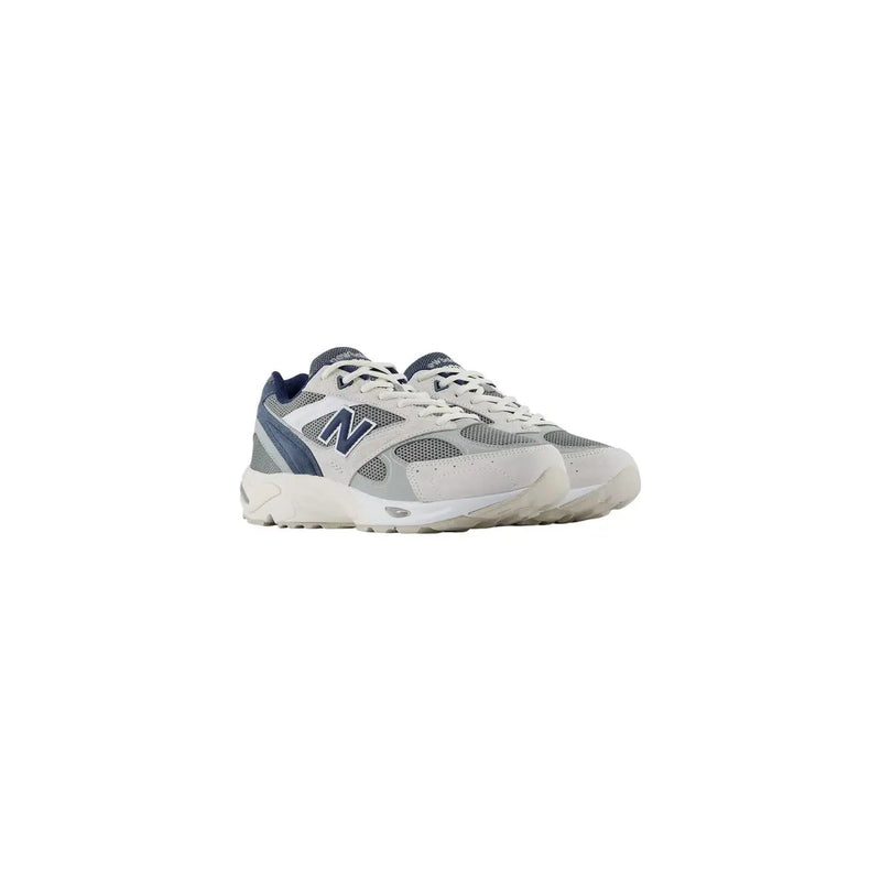 New Balance Baskets pour hommes en cuir suédé bleu, blanches et bleu marine, avec empiècements en mesh et synthétiques