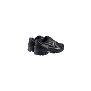 New Balance Baskets homme noires en synthétique avec détails argentés et semelle en caoutchouc texturé pour la course
