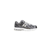 New Balance women’s black synthetic sneakers with gray mesh upper and cushioned sole