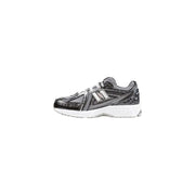 New Balance women’s black synthetic sneakers with gray mesh upper
