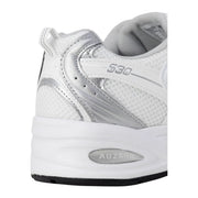 New Balance women grey faux leather sneakers with white and silver mesh upper, metallic accents, and 530 branding on side