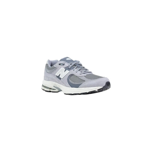 New Balance Baskets en cuir pour femmes, grises, avec empeigne en mesh et daim, semelle intermédiaire blanche et semelle extérieure noire, modèle printemps.