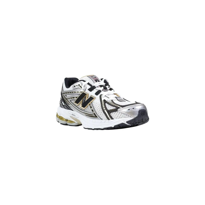 New Balance women silver synthetic sneakers with white and silver design, black accents, and gold-trimmed logo