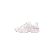 White new balance women suede sneakers with lilac leather accents and chunky layered sole visible from the back side