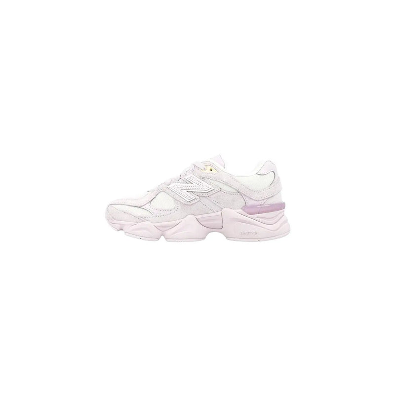 White new balance women suede sneakers with lilac leather accents and chunky layered sole visible from the back side