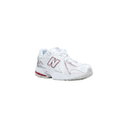 New balance women white synthetic running shoe with pink and silver accents displayed from the front