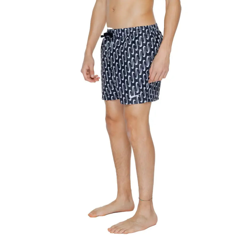 Navy blue Nike men’s swim trunks with white wavy pattern black drawstring waistband 100% polyester geometric design