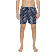 Navy blue Nike men’s swim trunks with white wavy pattern black drawstring waistband 100 percent polyester