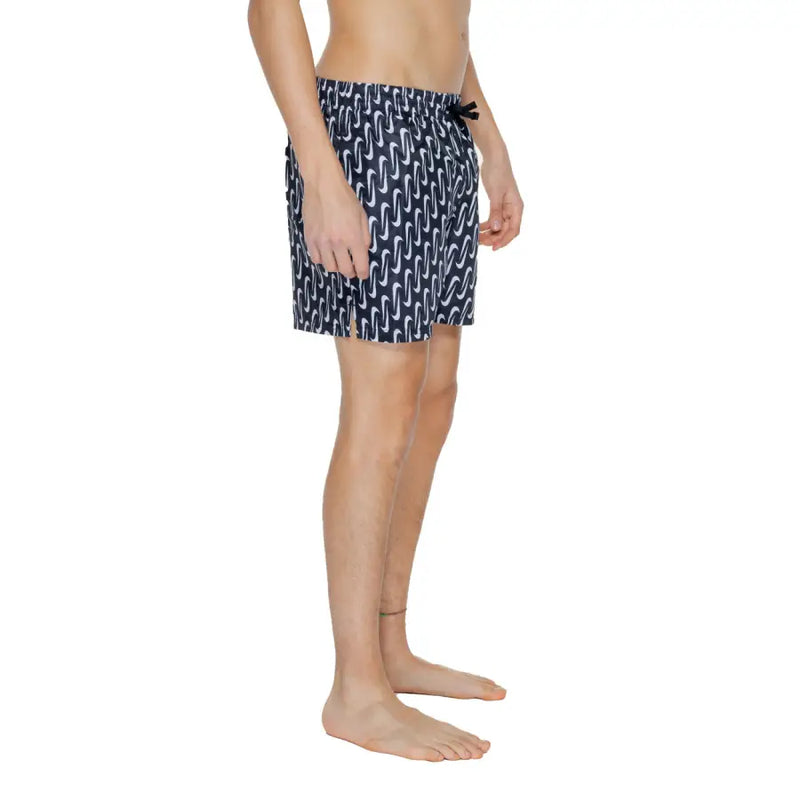 Navy blue Nike men’s swim trunks with white wavy pattern black drawstring waistband 100 percent polyester