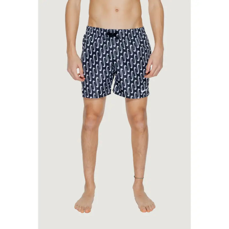 Navy blue Nike men’s swim trunks with white wavy pattern black drawstring waistband made of 100% polyester