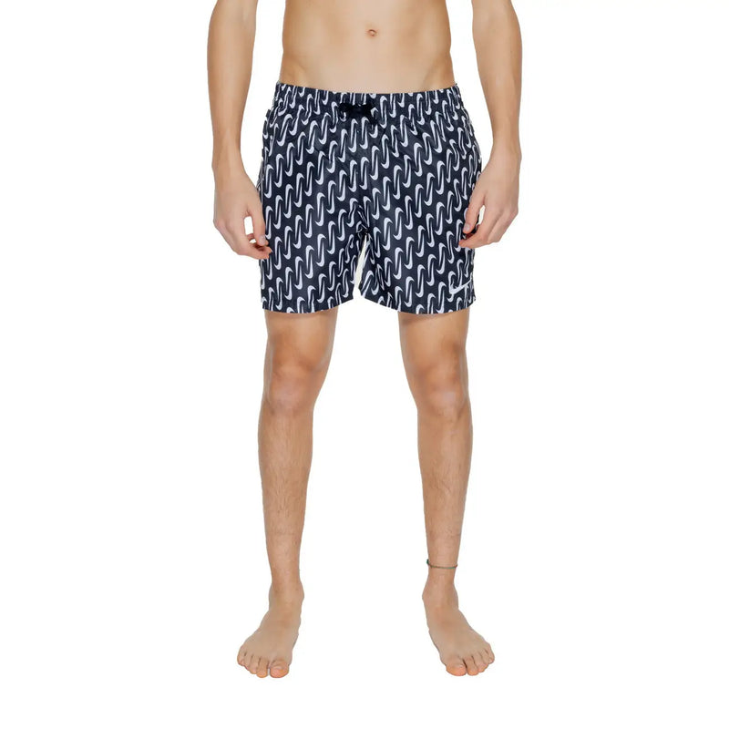 Navy blue Nike men’s swim trunks with white wavy pattern black drawstring waistband 100 percent polyester