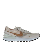Nike women’s pink slip-on sneakers featuring beige and gold waffle runner design with suede overlays and chunky white midsole