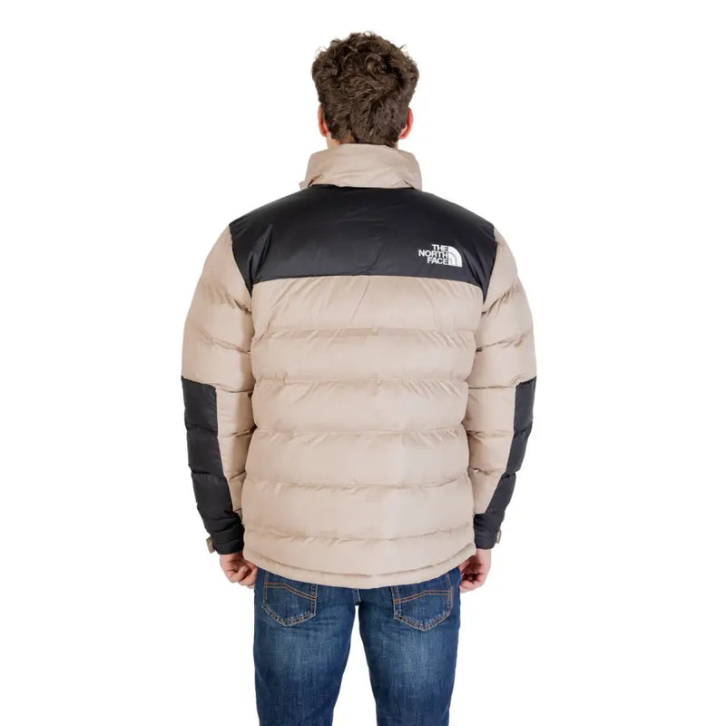 Beige and black puffer jacket with fur collar, the north face brand.