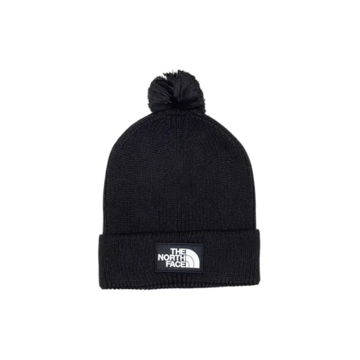 Black beanie with pom-pom and logo, the north face brand.