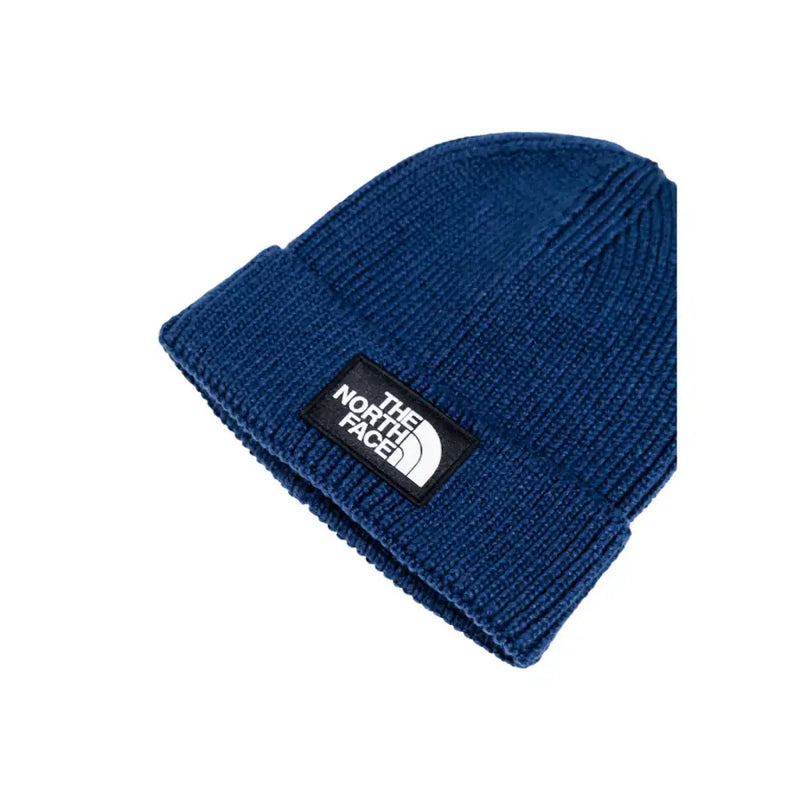Blue beanie with white logo and black strap, the north face brand.