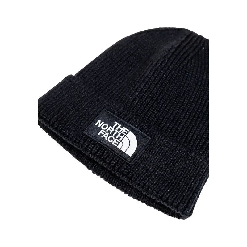 Bonnet The North Face noir en maille côtelée pour homme avec logo brodé blanc sur la visière repliée (vue de face)