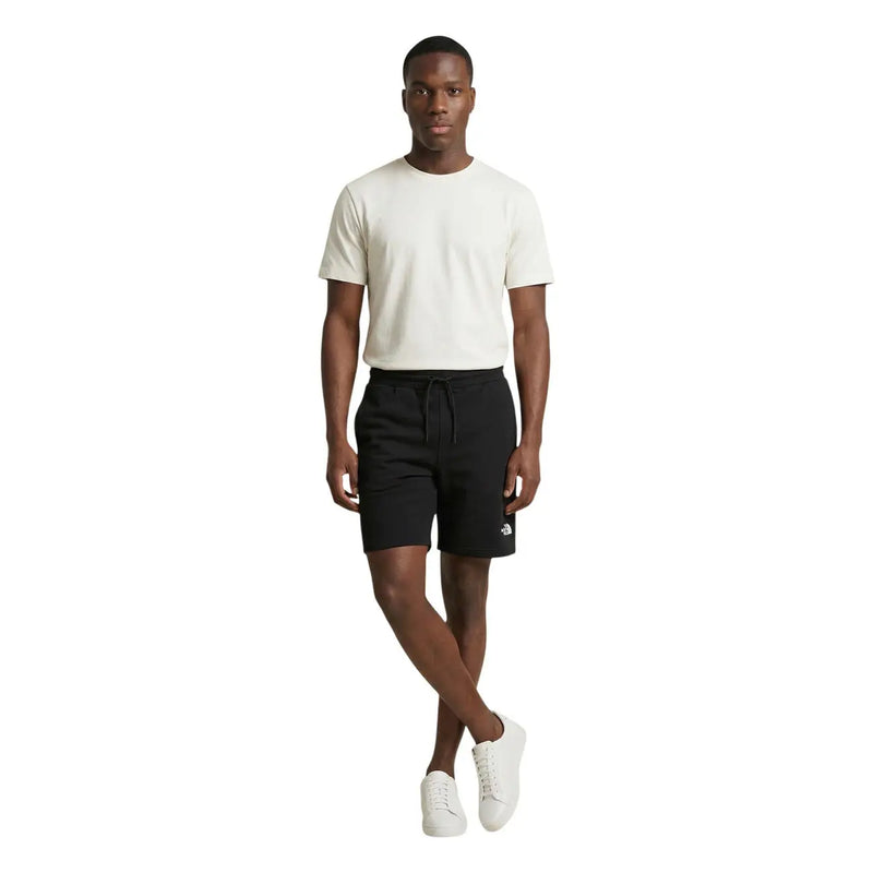 Short en coton noir The North Face pour homme, avec taille élastiquée à cordon et logo sur le bas de la jambe gauche, vue de face