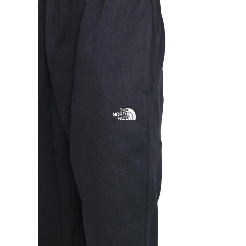 Pantalon de jogging The North Face pour homme, en molleton de coton noir, avec logo blanc brodé sur la cuisse