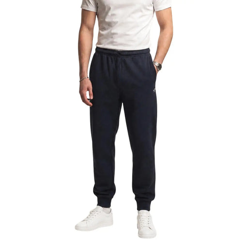 Pantalon de jogging The North Face pour homme, en molleton de coton noir, bleu marine, avec taille élastique et poignets côtelés.