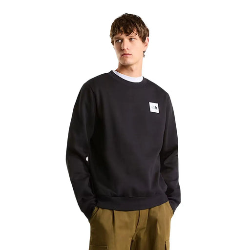 Sweat-shirt The North Face pour homme, col rond en coton noir, avec logo blanc sur la poitrine gauche, coupe classique